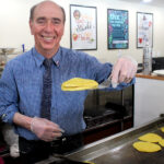 Volunteer and proud Acadian Don Raymond cooks up ployes at the University of Maine at Fort Kent Sucrerie on Thursday, March 9. (Jessica Potila | St. John Valley Times)