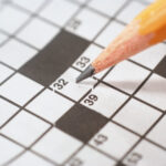 Photo of a crossword puzzle being filled out by pencil