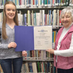 ST. AGATHA, Maine -- June 1, 2023 -- Long Lake Public Library Board President Lauren Paradis (left) and Jackie Ayotte, library co-founder and longtime board president, display the Maine 2022 Spirit of America Foundation Award the library received for its many years of serving the area. (Courtesy of Terry Ouellette)